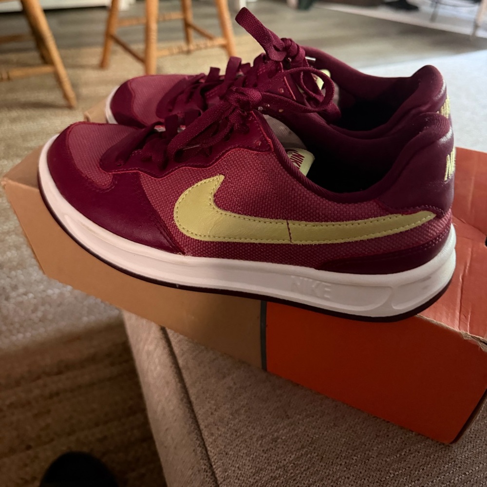 Nike Women's Maroon Athletic Sneakers with Pale Yellow Swoosh